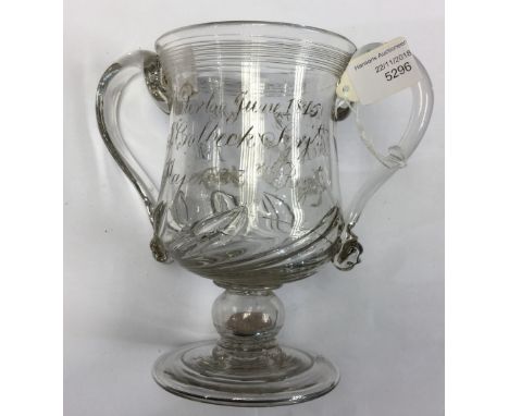 A Glass Loving cup with Georgian Coin set in the stem. Inscribed "Waterloo June 1815 J Colbeck, Sergt Major 33rd Regt" to fro