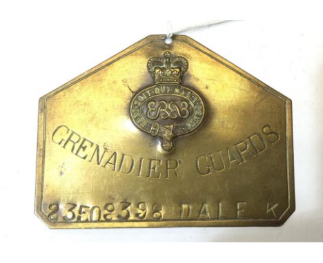 Grenadier Guards Brass Bed Plate. Queens Crown. Named to "23509398, Dale K". Maker marked to reverse "JR Guant, London".