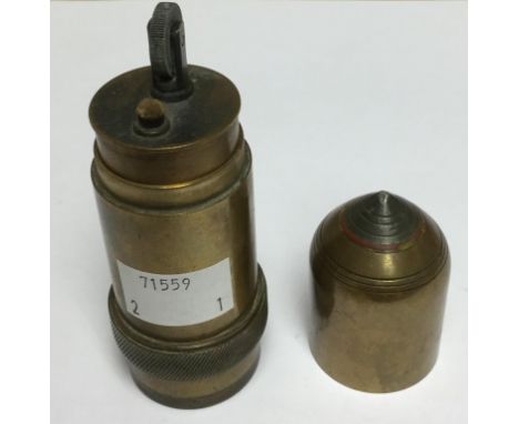 WW1 Cigarette Lighter in the form of a brass artillery shell. Well detailed with fuze in white metal with red paint detail an
