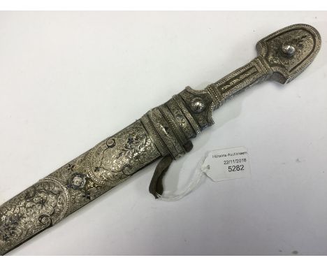 Causasian Silver mounted Kinjal dagger with 34cm long double edged double fullered blade with Cyrillic lettering and decorati