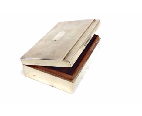 GEORGE V SILVER CIGAR BOXmaker's mark rubbed, Birmingham 1950, hinged cover initialed within engine turned borders, wood line
