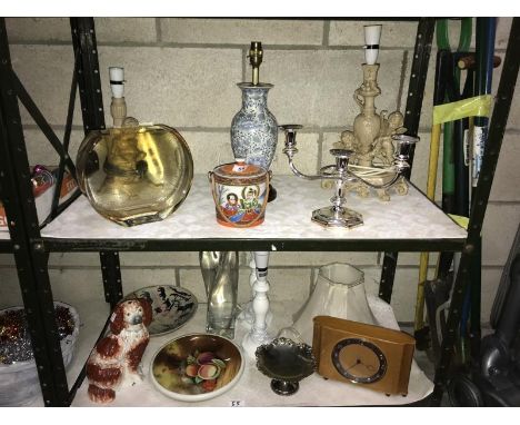 2 shelves of misc. incl. table lamps, clock, candelabra etc.