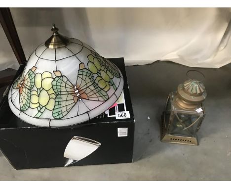 A modern glass light shade &amp; small brass lantern