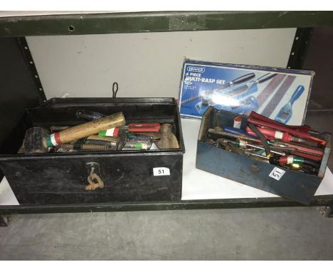 A shelf containing toolboxes and tools