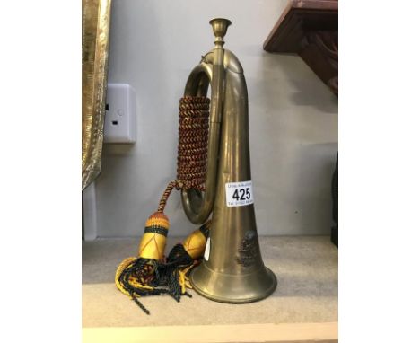 A bugle with later regimental badge and tassels