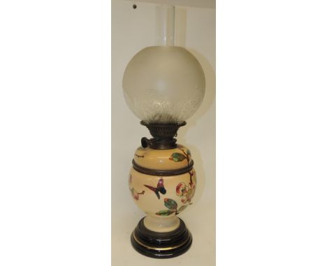 A Victorian oil lamp having etched glass shade, Messengers Patent Duplex burner and with glazed ceramic top to the reservoir 