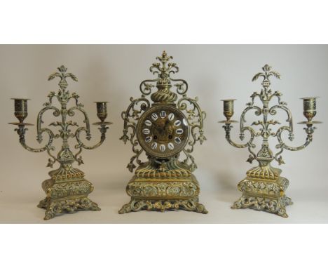 A late 19th Century mantel clock by Japy Freres having decorative brass dial with white enamel and black Roman numerals, hour