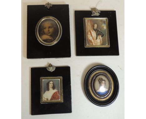 A 19th Century miniature portrait frame, black lacquered and with griffon mounted suspension loop together with three other 1