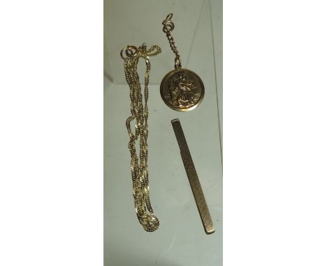 A 9ct gold tie grip/pin with engine turned decoration, a 9ct gold St Christopher medallion and a 9ct gold chain (replaced met