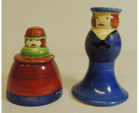 An unusual Clarice Cliff Bizarre Newport Pottery figural pepperette and mustard pot, the mustard modelled as a woman with wid