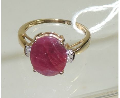 A 9ct gold ring set with a large Ratnapuri ruby in open work mount.  Ring size 0+