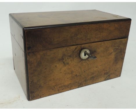 A 19th Century boxwood tea caddy with two lidded compartments, with key, 14.5cms high 24cms wide 14cms deep