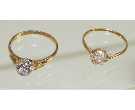 An 18ct gold, illusion set diamond solitaire ring, size R and an unmarked gold ring set with small diamonds in a flowerhead d