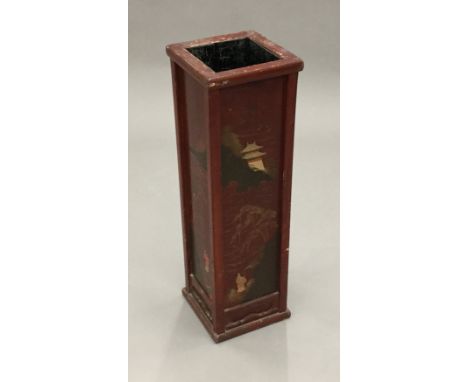 An early 20th century japanned lacquered stick stand