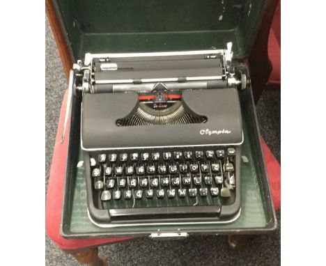 An Olympia De Luxe portable typewriter, in original case