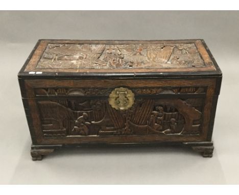 An Eastern carved hardwood trunk