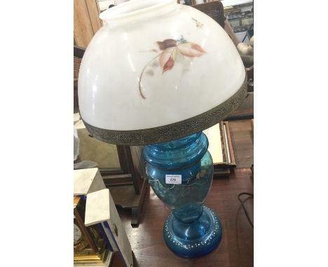 A Victorian blue glass oil lamp with enamel painted decoration and with painted opaline shade