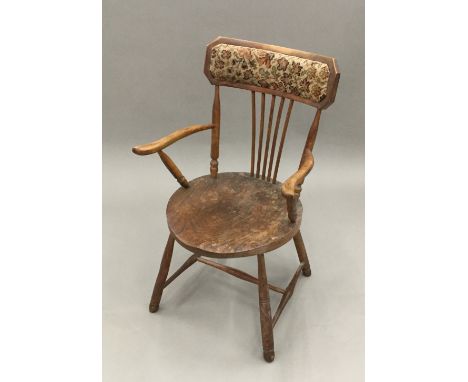 A Victorian elm seated stick back chair