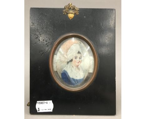 A 19th century portrait miniature depicting a young lady