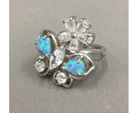 A silver opal and cubic zirconia ring