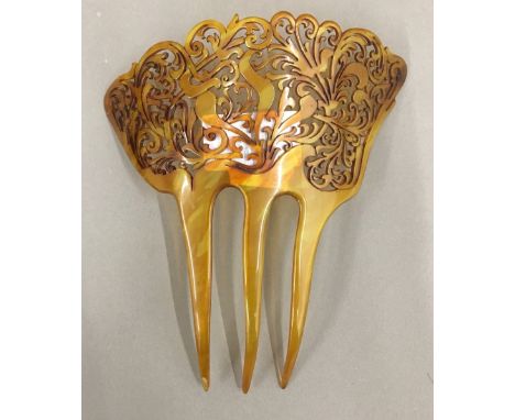 A carved antique blonde tortoiseshell hair comb. 15 cm high