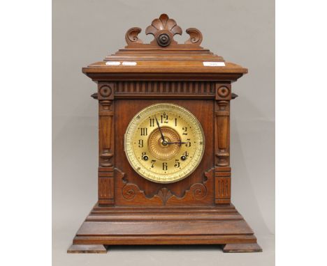 A late 19th century walnut cased Ansonia mantle clock