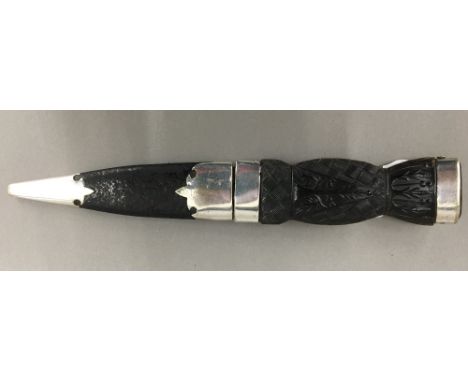 A Victorian Scottish skean dhu (sgian dubh) with pressed horn grip, with thistle and braid decoration and cairngorm stone ter