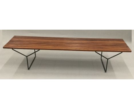 A modern wooden topped tubular framed bench.  183 cm long; 47 cm wide; 39 cm high.