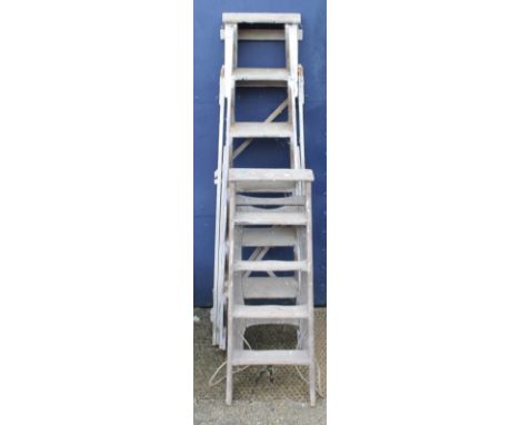 Two sets of step ladders