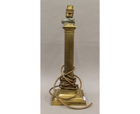 A brass Corinthian column table lamp