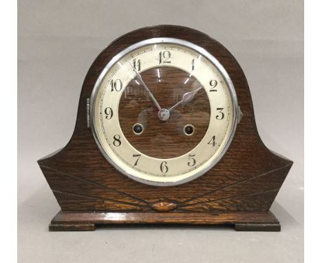 An oak mantle clock