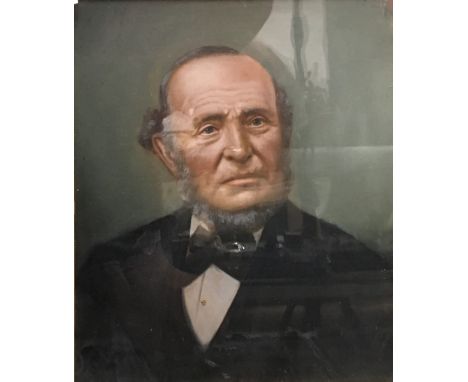 A Victorian over painted portrait of a bearded gentleman, framed and glazed