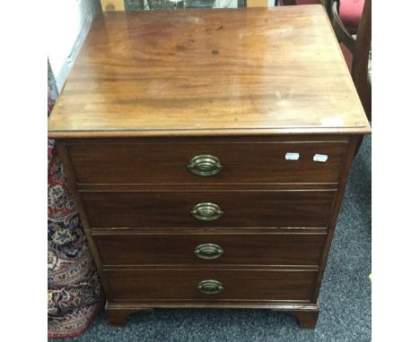 A 19th century mahogany commode chest. 73 cm high; 60.5 cm wide; 51 cm deep.