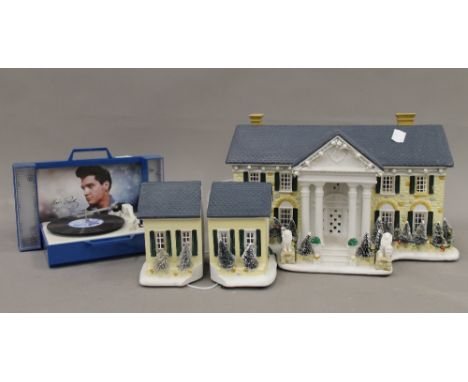 An Elvis Presley record player and a musical Gracelands model