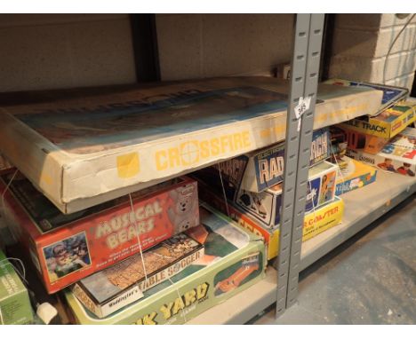 Two shelves of mixed vintage games 