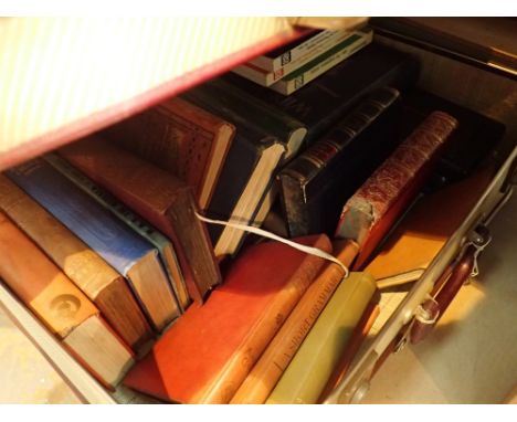 Vintage suitcase containing books 