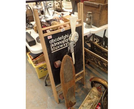 Easel toy rifle and vintage skateboard