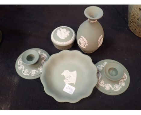 Five pieces of Wedgwood green Jasperware small vase trinket box pair of squat candlesticks and a small bowl