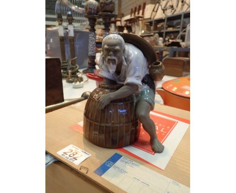 Oriental tea set and a ceramic Chinese mud man