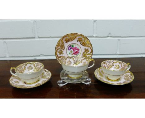 A Paragon fine bone china rose patterned demitasse set with pale pink ground and gilt highlights, comprising twelve cups and 