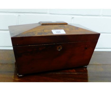 A 19th century mahogany sarcophagus shaped tea caddy with a glass mixing bowl to the interior raised on four bun feet, 28 x 1
