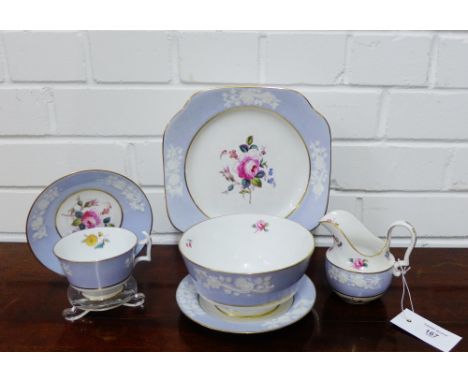 A Spode Copeland china tea set with floral moulded sprays against a lilac ground with further hand painted floral sprays and 