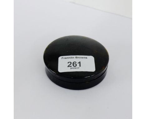 An early 19th century tortoiseshell snuff box, the circular lid engraved with contemporary initials, 7.5cm diameter