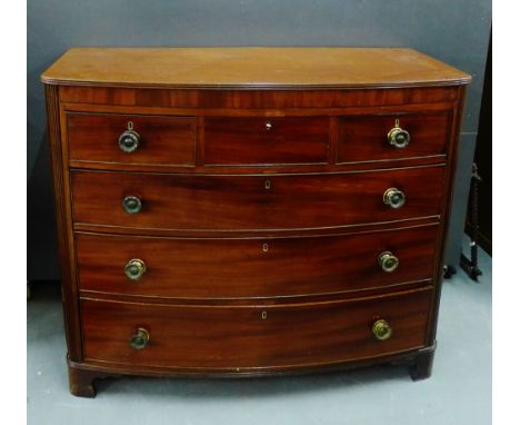 A 19th century mahogany and inlaid bow front chest, the rectangular top over three short and three long drawers, on bracket f