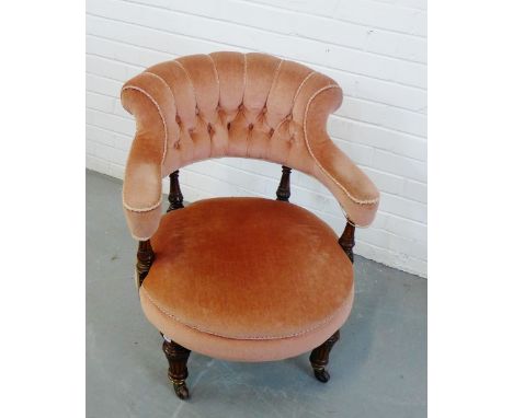 A button back upholstered chair with circular seat and mahogany turned wood supports, 