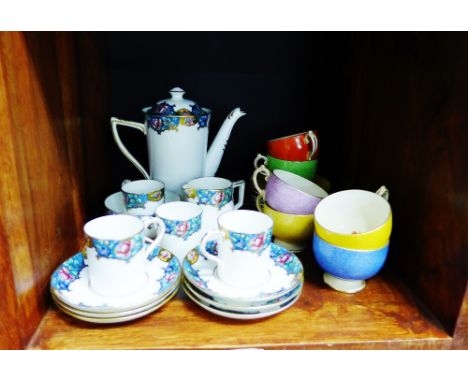 A collection of Grosvenor bone china harlequin coloured tea cups and saucers, together with a small white glazed porcelain co