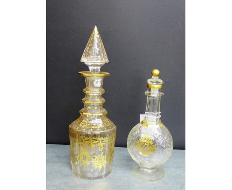 A 19th century gilt glass decanter and stopper painted with classical swags and stars with a facet cut domed finial, 30cm hig