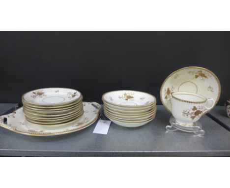A quantity of 19th century English porcelain tea wares, decorated with gilded floral sprays and dash borders, comprising nine
