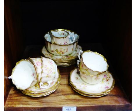 Blush ivory floral patterned tea wares to include five cups, six saucers, four side plates, milk jug and sugar bowl