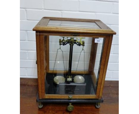 A Sartorius-Werke Gottingen brass lacquered balance scale, numbered 41206, contained within a glazed case